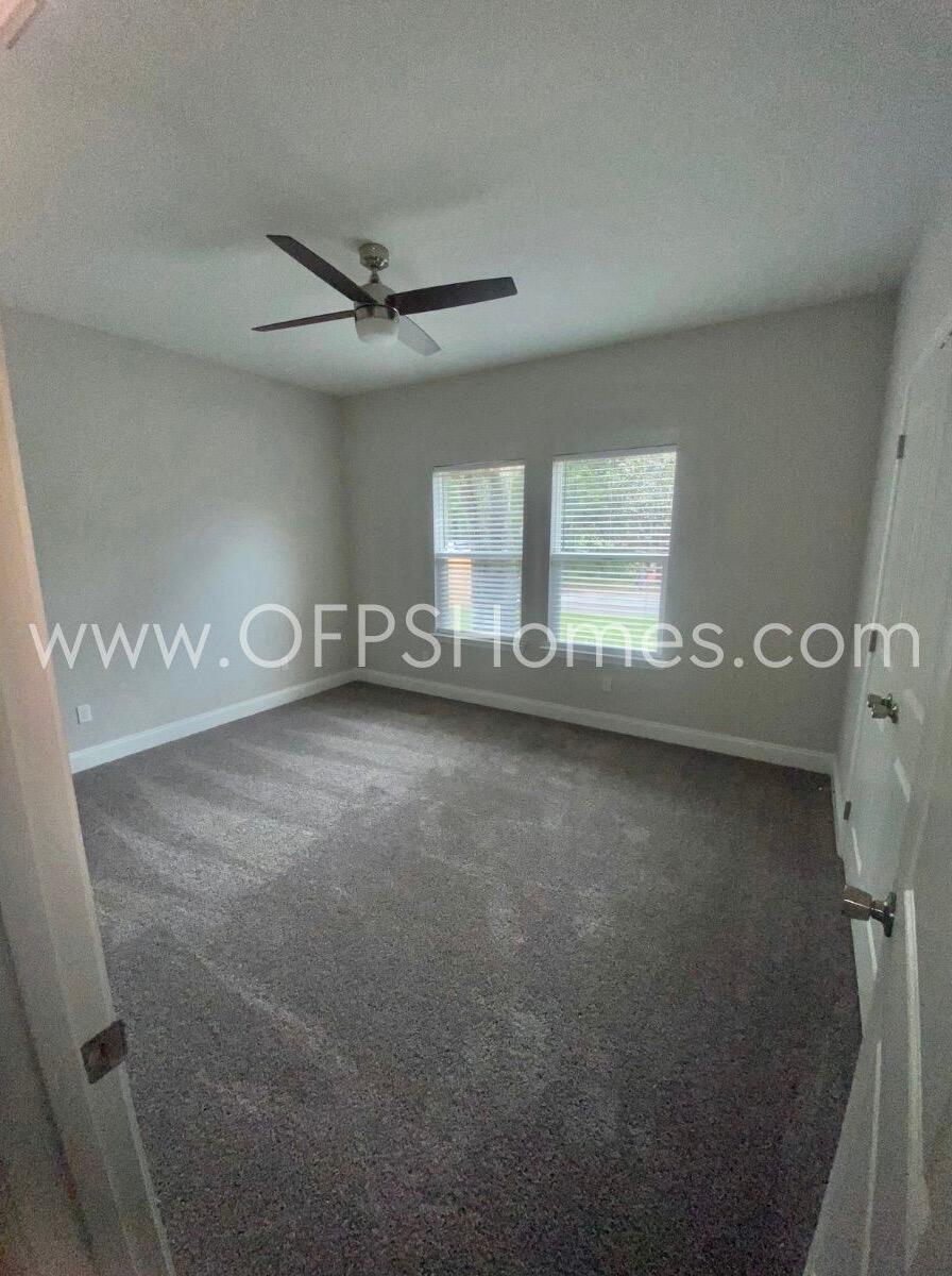 519 Friendship Road Mary Esther, FL 32569 - Photo 8 of 10 an empty room with windows