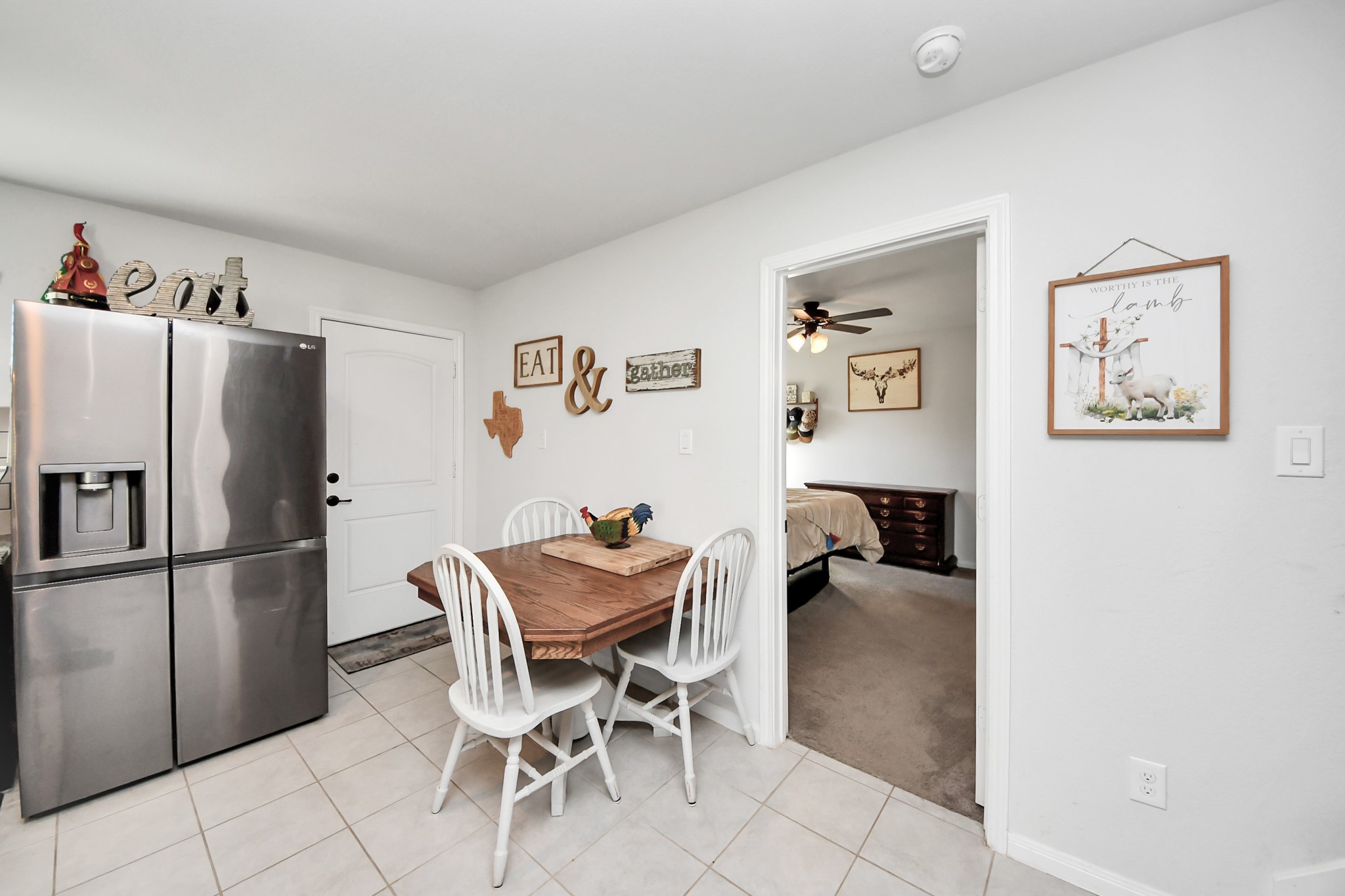 15291 Arrowhead Loop West Willis, TX 77378 - Photo 12 of 28 This cozy kitchen features a modern stainless steel refrigerator