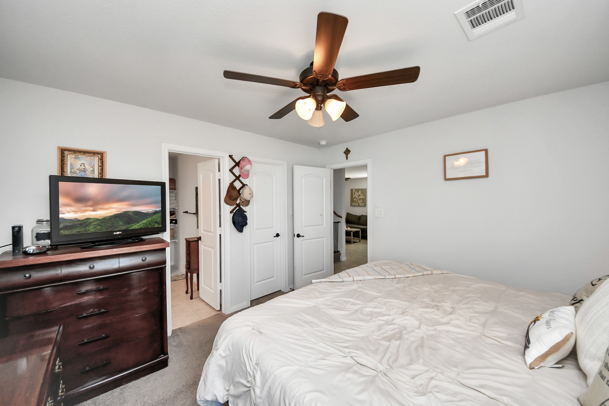 15291 Arrowhead Loop West Willis, TX 77378 - Photo 19 of 28 Primary bedroom view of the door and bathroom.
