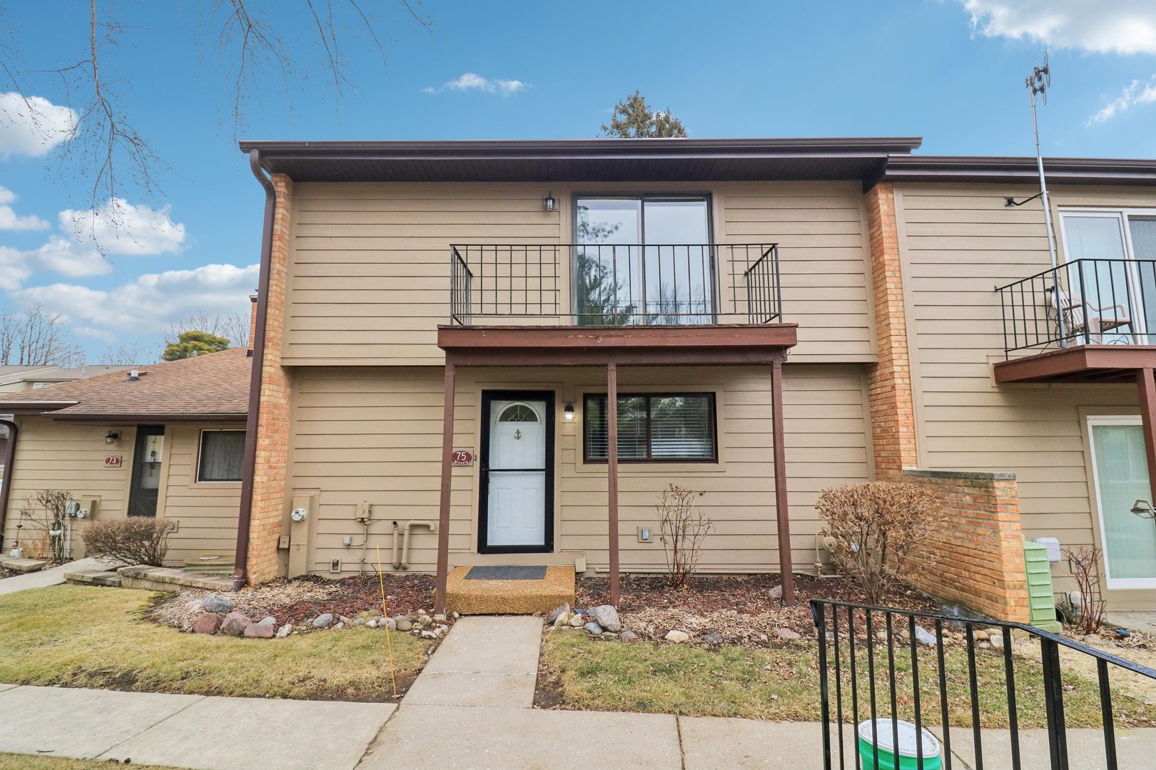 a front view of a house with garden