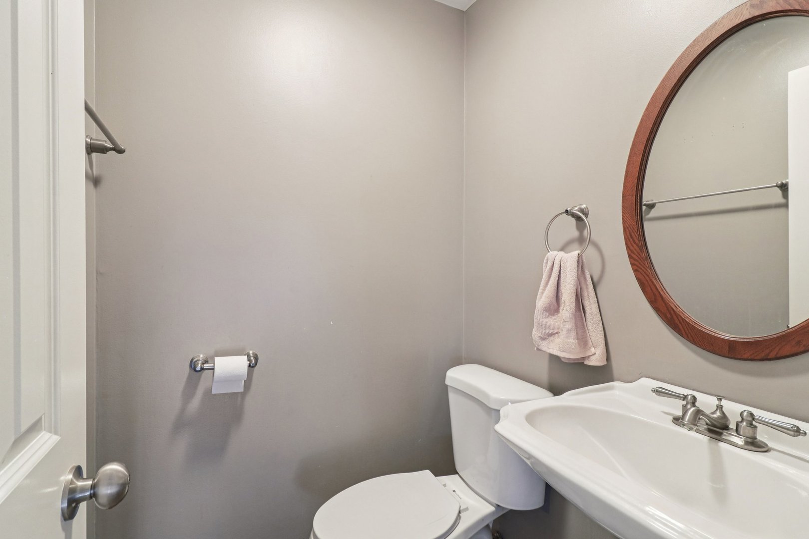 75 Mineola Road, Unit 75 Fox Lake, IL 60020 - Photo 14 of 33 a bathroom with a sink mirror and toilet