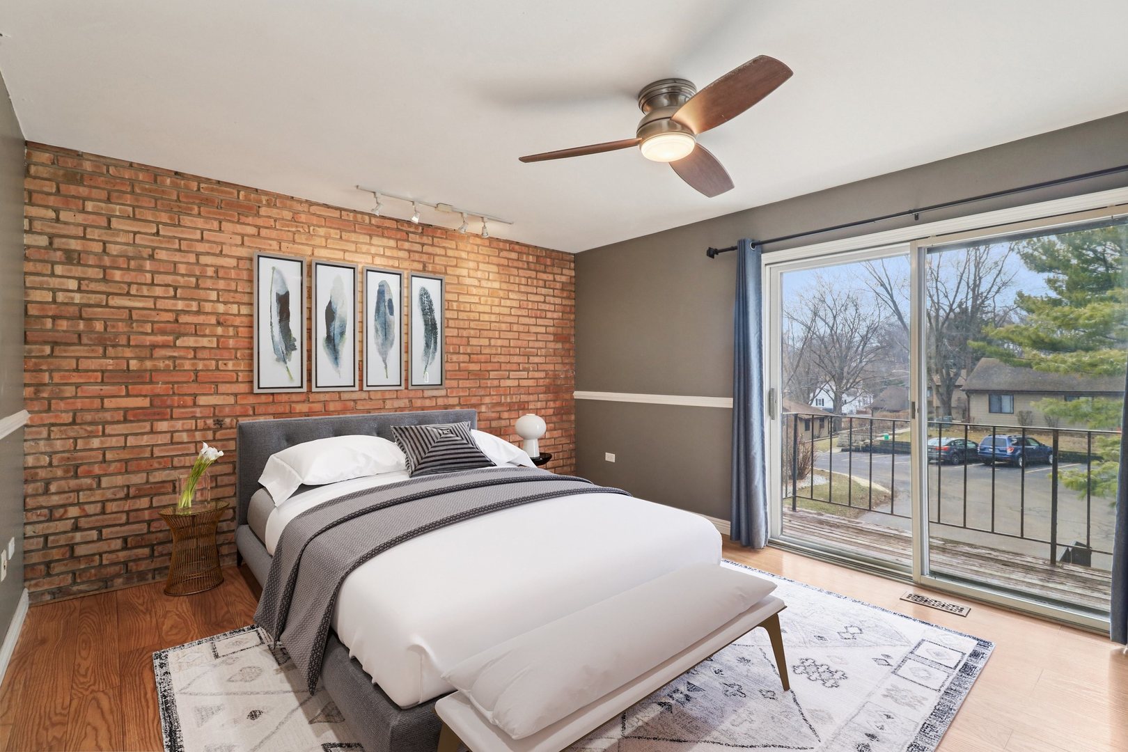 75 Mineola Road, Unit 75 Fox Lake, IL 60020 - Photo 15 of 33 a bedroom with a bed and a large window
