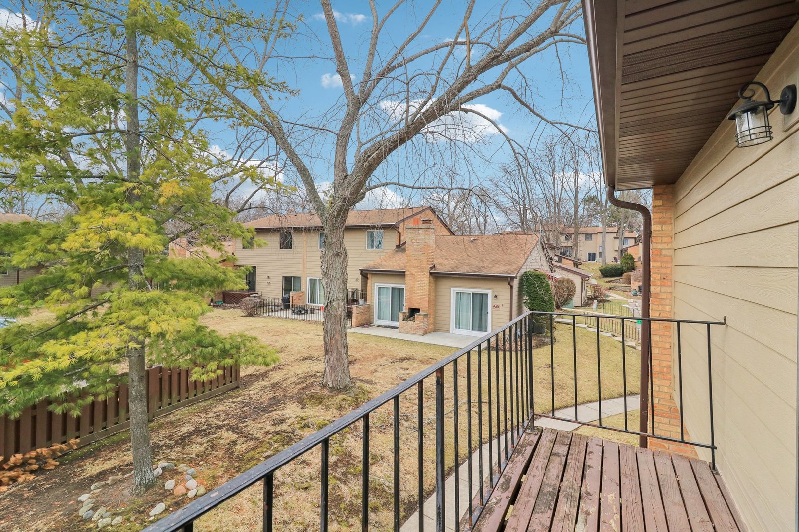 75 Mineola Road, Unit 75 Fox Lake, IL 60020 - Photo 17 of 33 a view of a house with wooden deck next to a yard