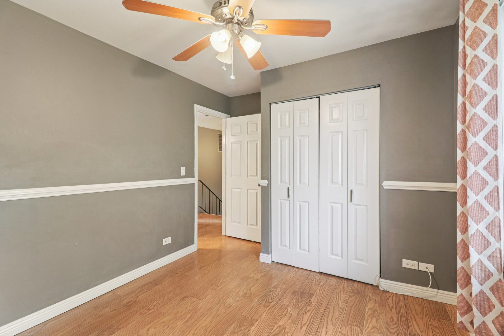 75 Mineola Road, Unit 75 Fox Lake, IL 60020 - Photo 25 of 33 an empty room with wooden floor closet and windows