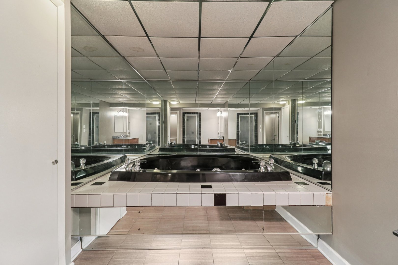 75 Mineola Road, Unit 75 Fox Lake, IL 60020 - Photo 28 of 33 a kitchen with a counter and a stove top oven