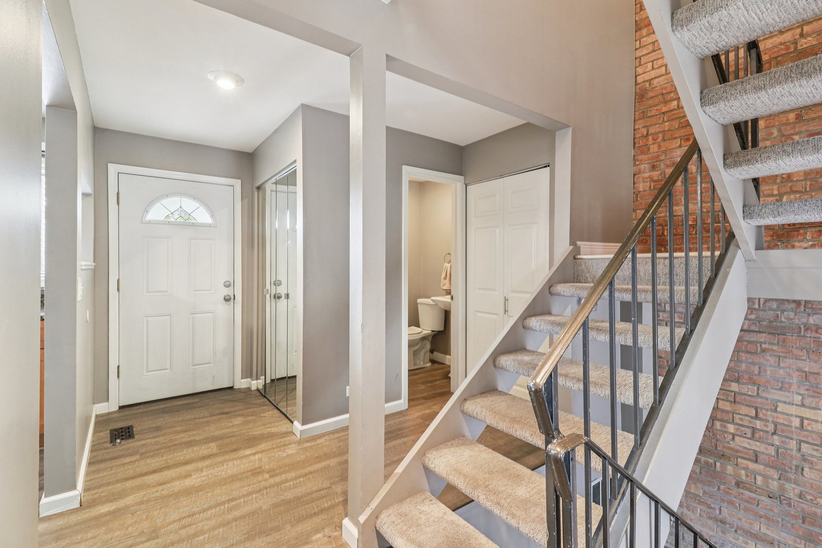 75 Mineola Road, Unit 75 Fox Lake, IL 60020 - Photo 3 of 33 a view of an entryway with staircase