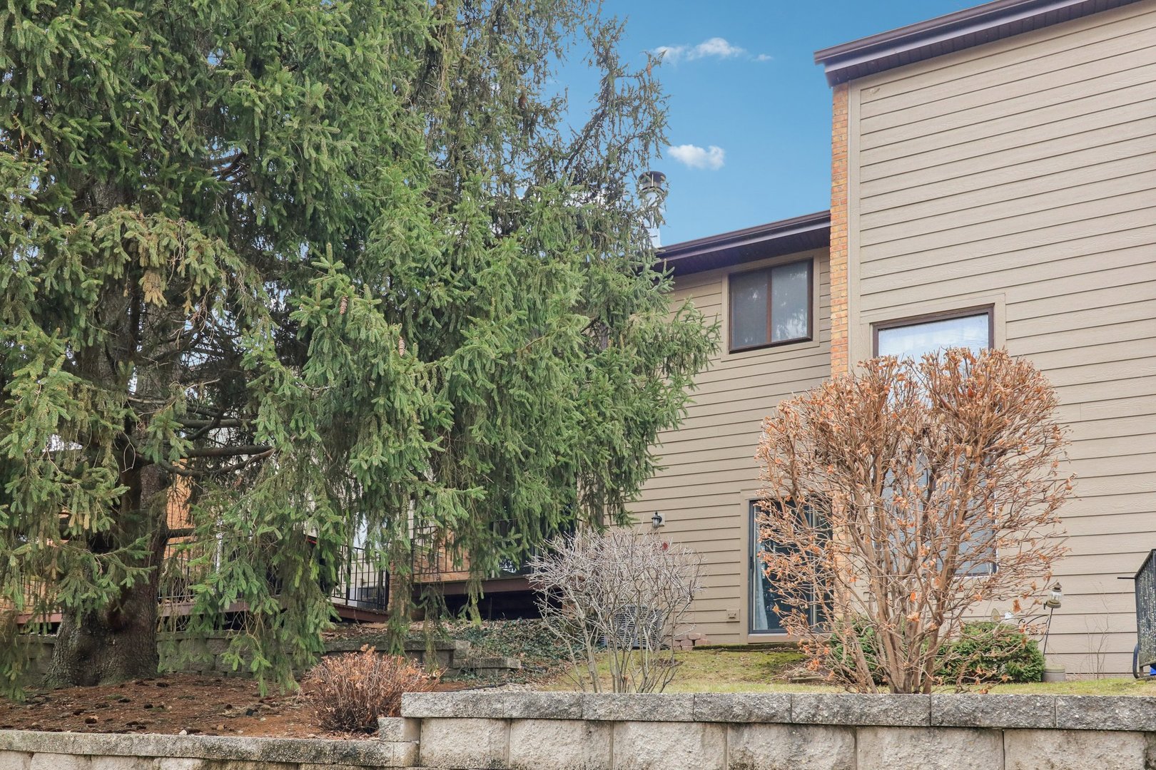 75 Mineola Road, Unit 75 Fox Lake, IL 60020 - Photo 32 of 33 a front view of a house with garden