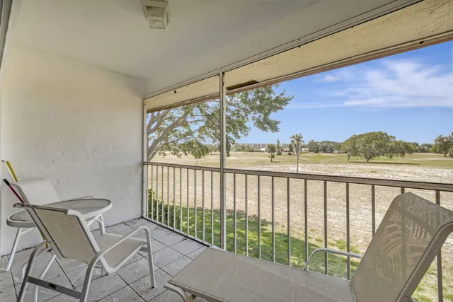 a view of balcony with furniture