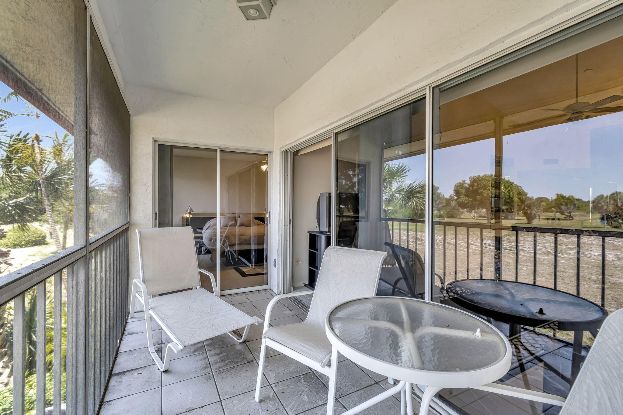 280 Northwest 67th Street, Unit B 207 Boca Raton, FL 33487 - Photo 12 of 13 a dining room with furniture and large windows