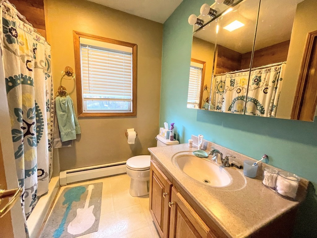 14 Mt Henry Road Shirley, MA 01464 - Photo 15 of 29 a bathroom with a sink and a mirror