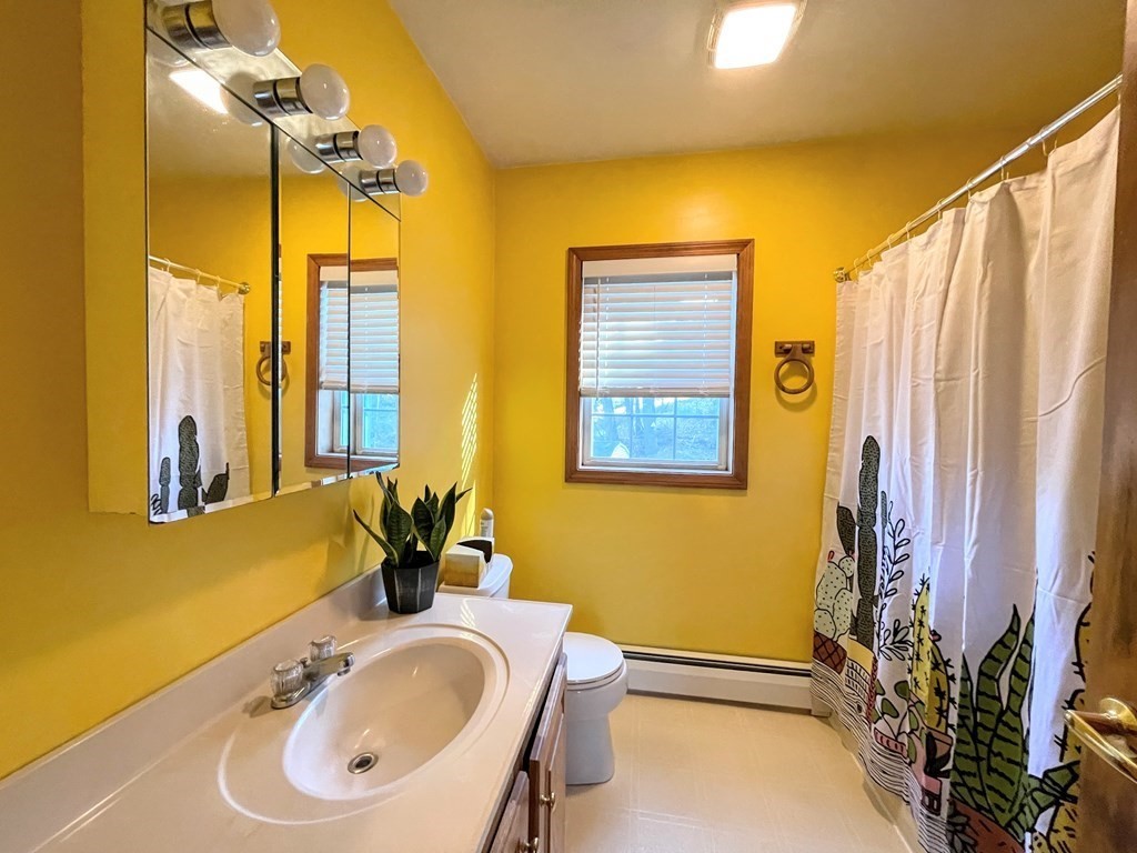 14 Mt Henry Road Shirley, MA 01464 - Photo 17 of 29 a bathroom with a tub sink and mirror