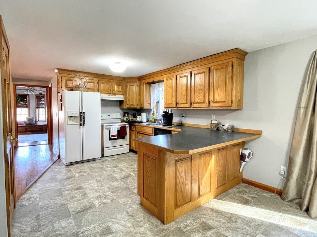 14 Mt Henry Road Shirley, MA 01464 - Photo 5 of 29 a kitchen with stainless steel appliances granite countertop a refrigerator a stove a sink and a refrigerator
