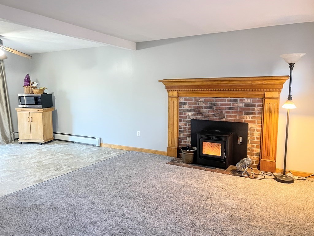14 Mt Henry Road Shirley, MA 01464 - Photo 7 of 29 a view of an empty room with a fireplace