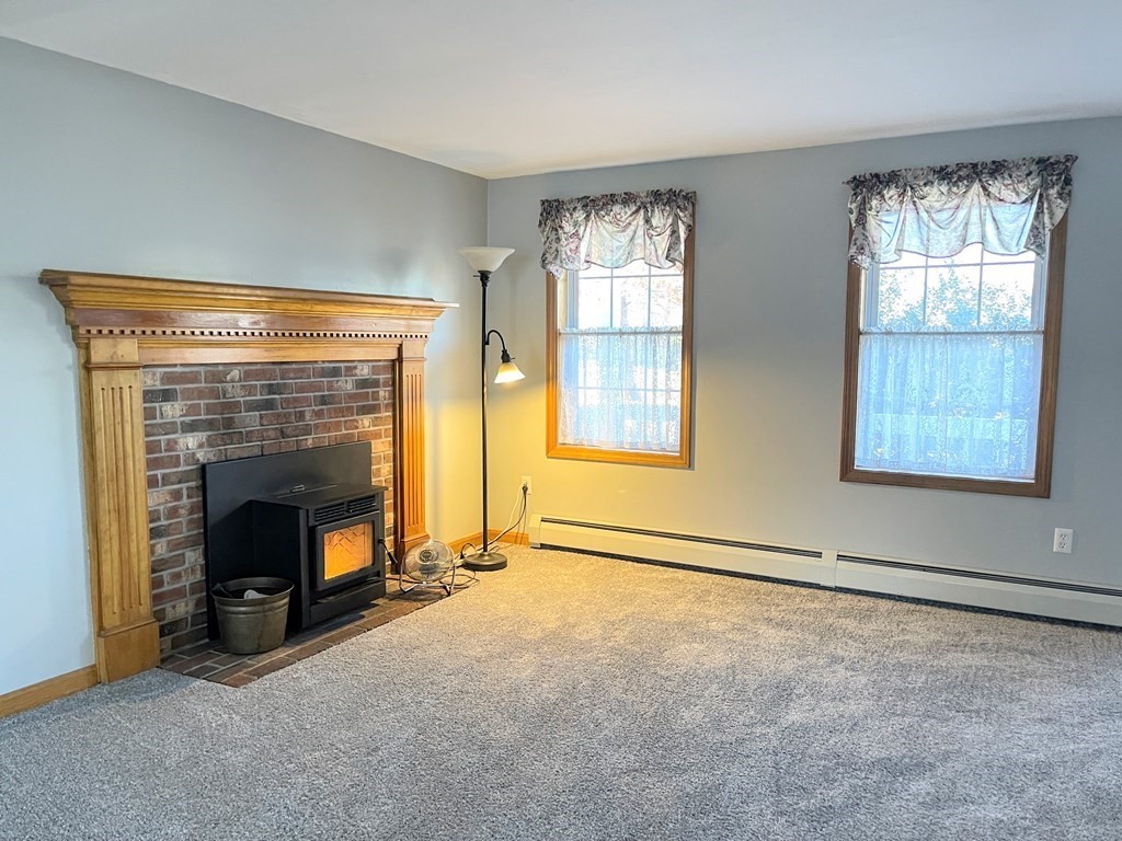 14 Mt Henry Road Shirley, MA 01464 - Photo 8 of 29 an empty room with fireplace and windows