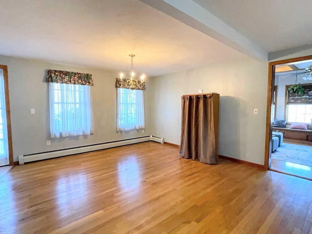14 Mt Henry Road Shirley, MA 01464 - Photo 10 of 29 an empty room with wooden floor and windows