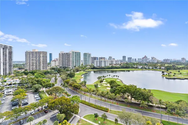 a view of a city with a lake