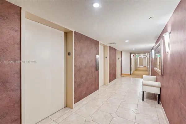 a bathroom with a glass door shower and a sink
