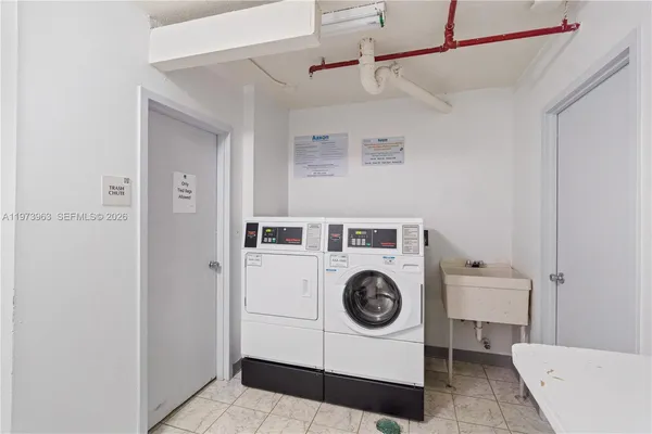 a utility room with dryer and washer