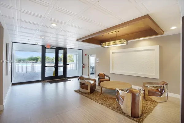 a living room with furniture window and wooden floor