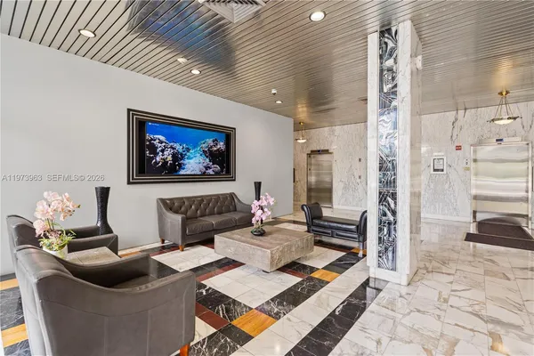 a living room with furniture and a rug