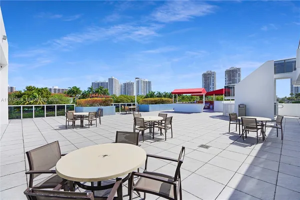 a view of a terrace with furniture and garden