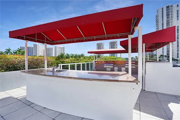 a view of a house with a porch and a yard