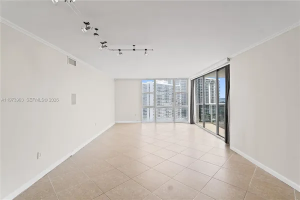 a view of an empty room with a window