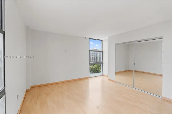 a view of an empty room with a window