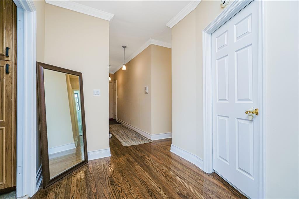 351 Marine Avenue, Unit F11 Brooklyn, NY 11209 - Photo 11 of 23 a view of a hallway with wooden floor and entryway