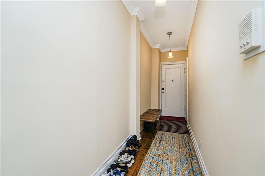 351 Marine Avenue, Unit F11 Brooklyn, NY 11209 - Photo 12 of 23 a view of a bathroom with a sink and a toilet