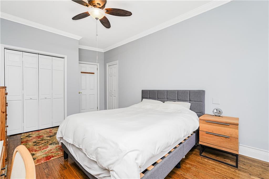351 Marine Avenue, Unit F11 Brooklyn, NY 11209 - Photo 16 of 23 a bedroom with a bed and wooden floor