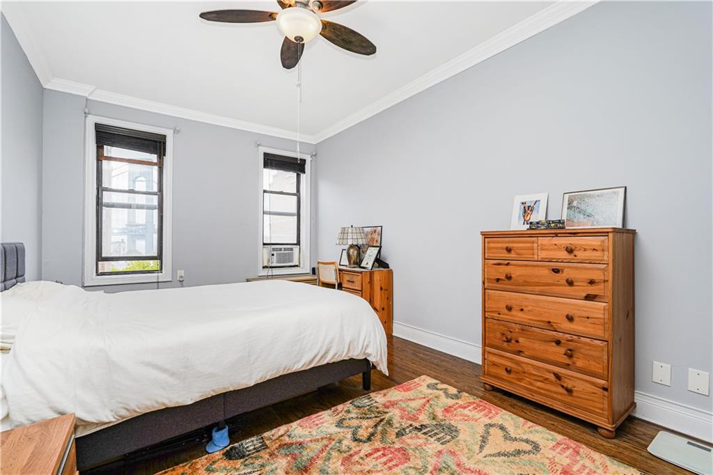 351 Marine Avenue, Unit F11 Brooklyn, NY 11209 - Photo 17 of 23 a bedroom with a bed and a dresser