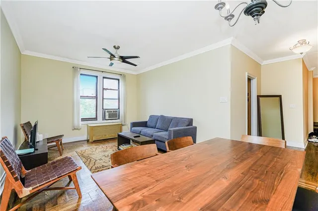 a bedroom with a bed a couch and a window