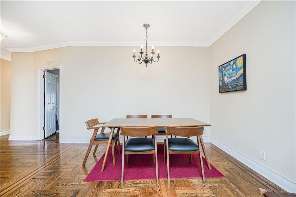 351 Marine Avenue, Unit F11 Brooklyn, NY 11209 - Photo 5 of 23 a view of a dining room with furniture and wooden floor
