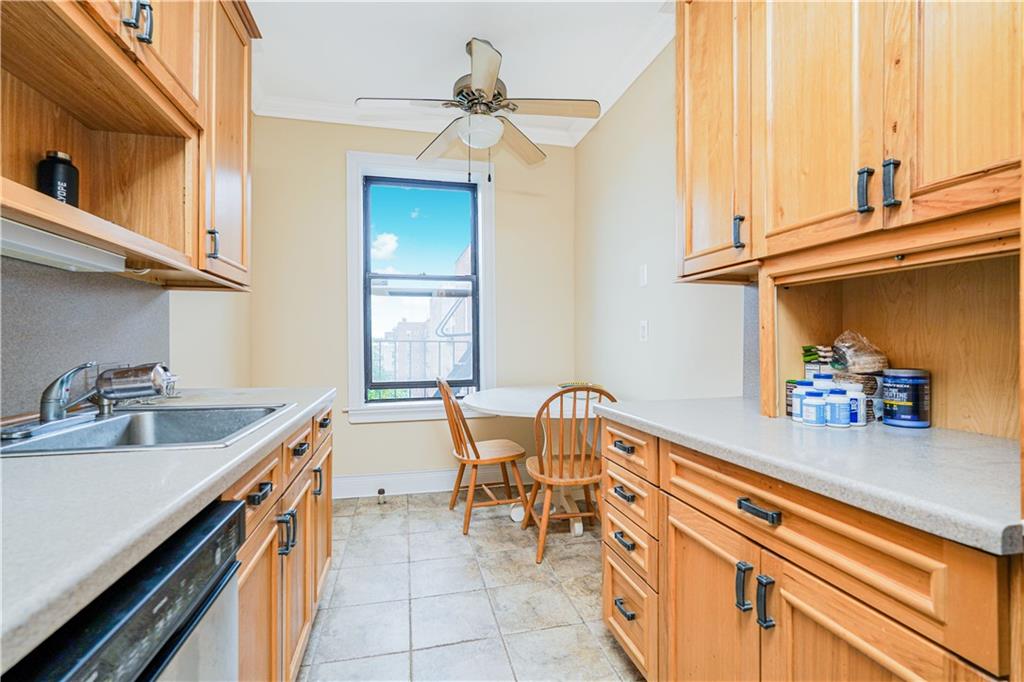 351 Marine Avenue, Unit F11 Brooklyn, NY 11209 - Photo 7 of 23 a kitchen with a sink and cabinets