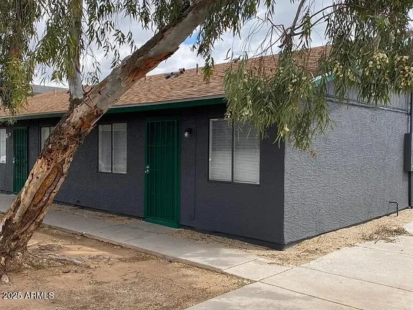 a house with trees in front of it