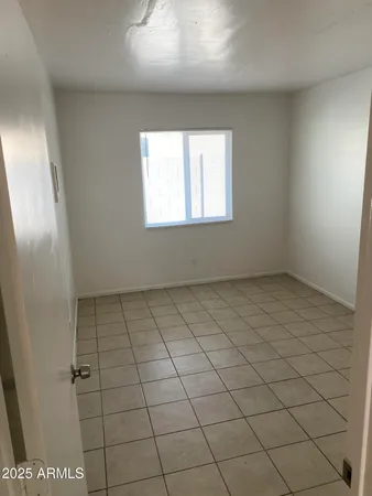 en empty room with windows