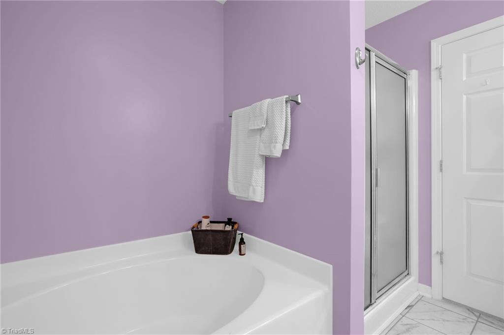2786 WaterStone Loop High Point, NC 27265 - Photo 19 of 30 Primary Bath provides garden soaking tub and a separate walk-in shower.