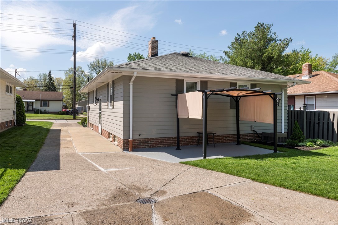 13175 McCracken Road Cleveland, OH 44125 - Photo 41 of 48 Back of house with a yard