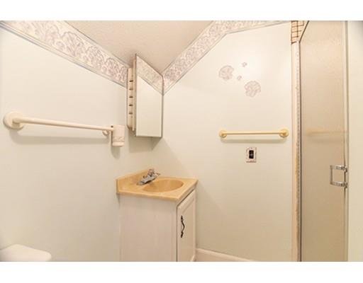 15-17 Windham Road Pelham, NH 03076 - Photo 14 of 16 a bathroom with a shower and a sink