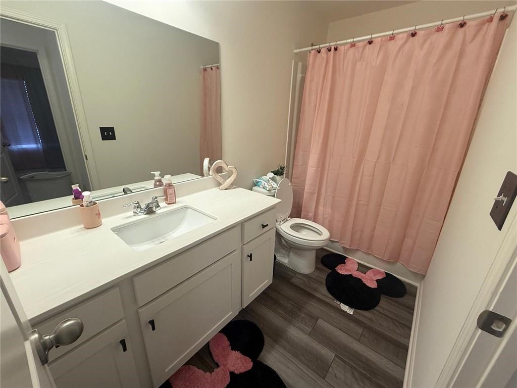 59 Thetford Way Winder, GA 30680 - Photo 12 of 13 a bathroom with a sink and a mirror