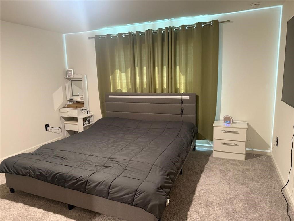 59 Thetford Way Winder, GA 30680 - Photo 7 of 13 a bedroom with a bed and window