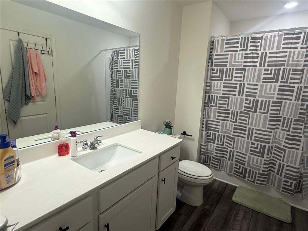 59 Thetford Way Winder, GA 30680 - Photo 10 of 13 a bathroom with a sink toilet and shower