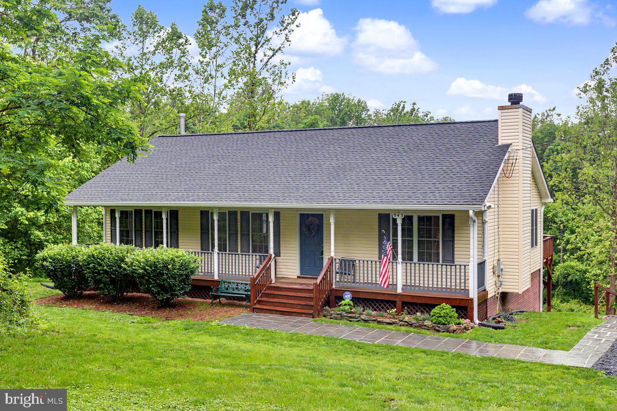 543 Whiskey Still Road Linden, VA 22642 - Photo 2 of 23 a view of house with a yard and a garden