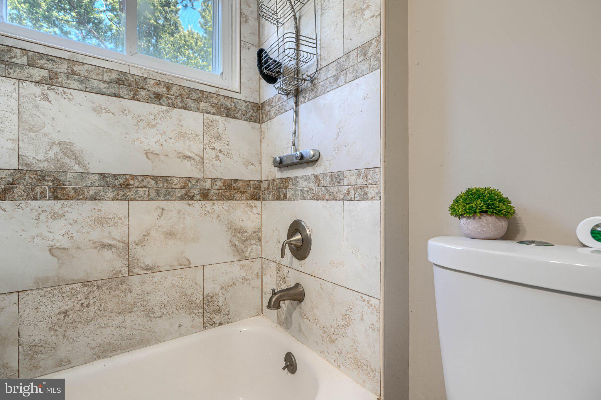 3708 Cassen Road Randallstown, MD 21133 - Photo 30 of 38 a bathroom with a bathtub and shower