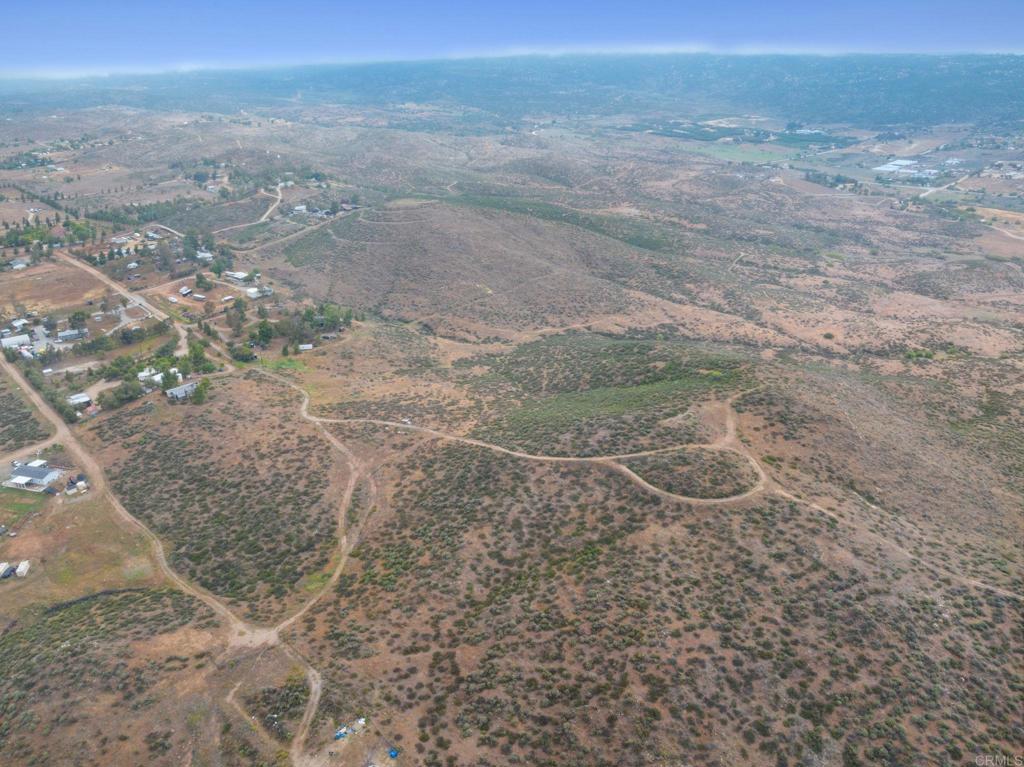 0 Ravenna Lane Hemet, CA 92544 - Photo 23 of 47 a view of a dry yard with wooden fence