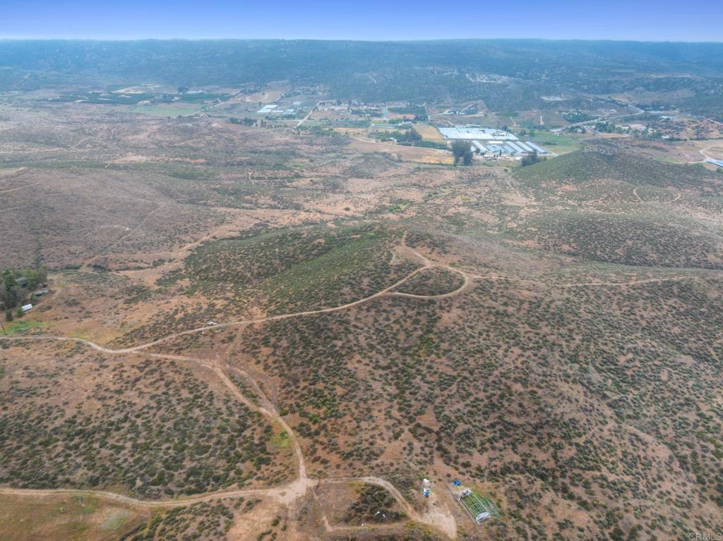 0 Ravenna Lane Hemet, CA 92544 - Photo 24 of 47 a view of a dry yard with wooden fence