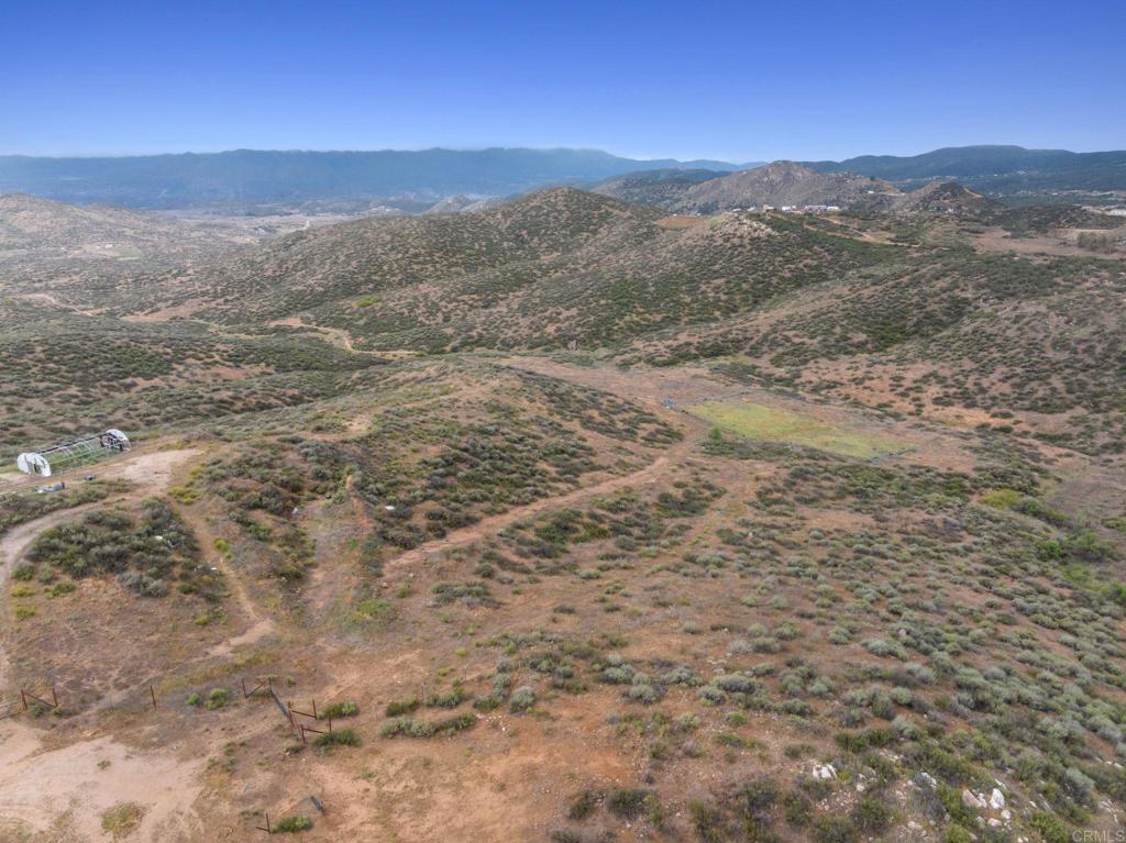0 Ravenna Lane Hemet, CA 92544 - Photo 30 of 47 a view of a dry yard with mountains in the background