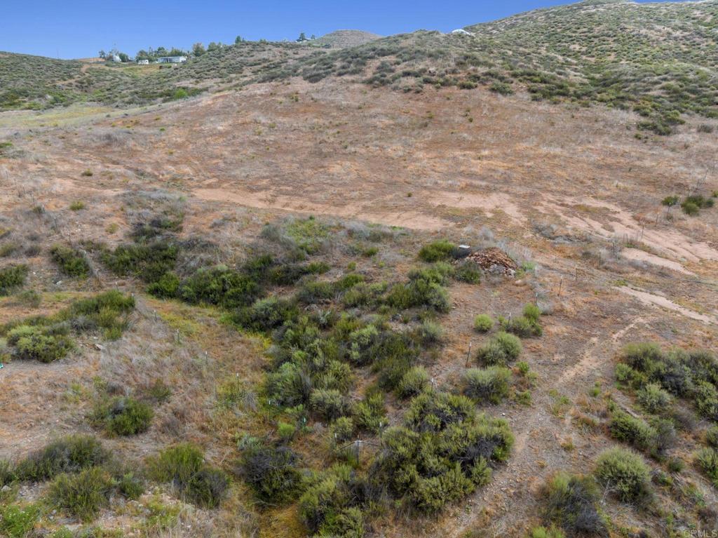 0 Ravenna Lane Hemet, CA 92544 - Photo 38 of 47 a view of a dry field with trees in the background