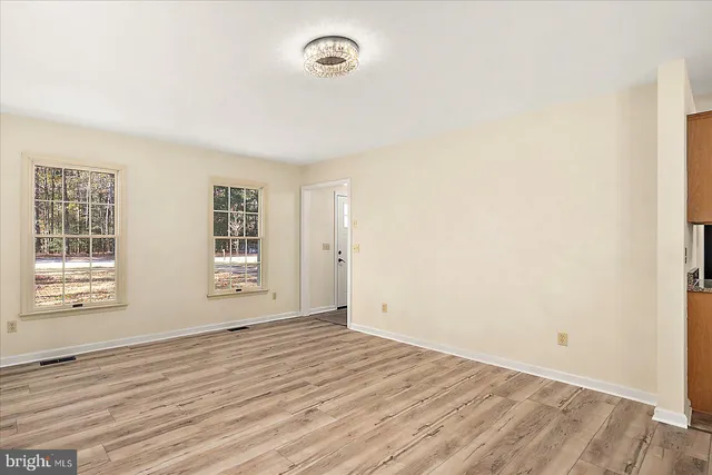 a kitchen with granite countertop a refrigerator a stove and a sink